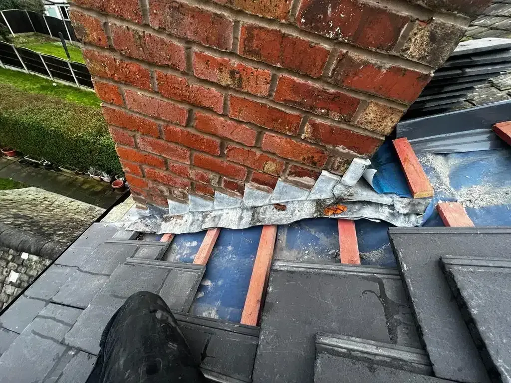 Chimney stack and lead flashing on a roof